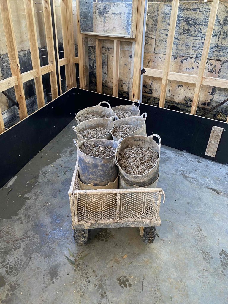 Hempcrete in buckets in trolley