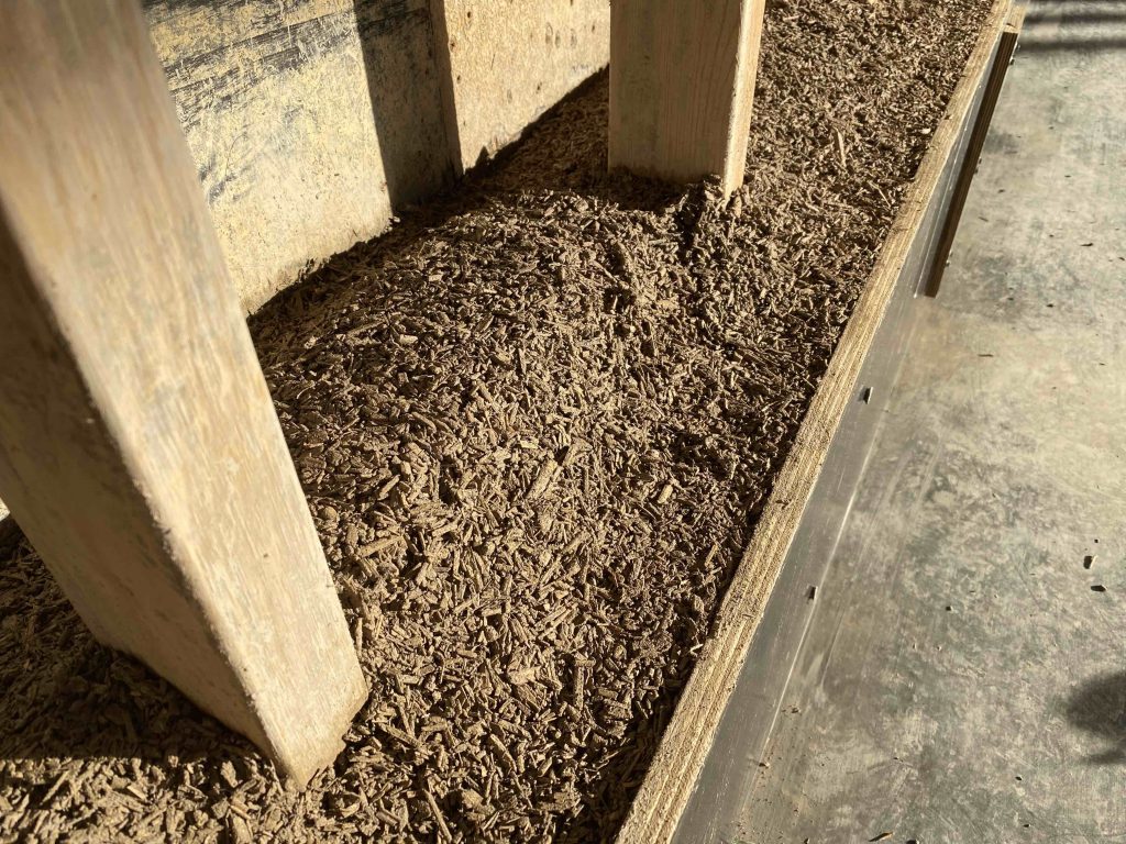 Hempcrete in wall around structural frame